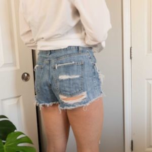 CARMAR DISTRESSED DENIM SHORTS.